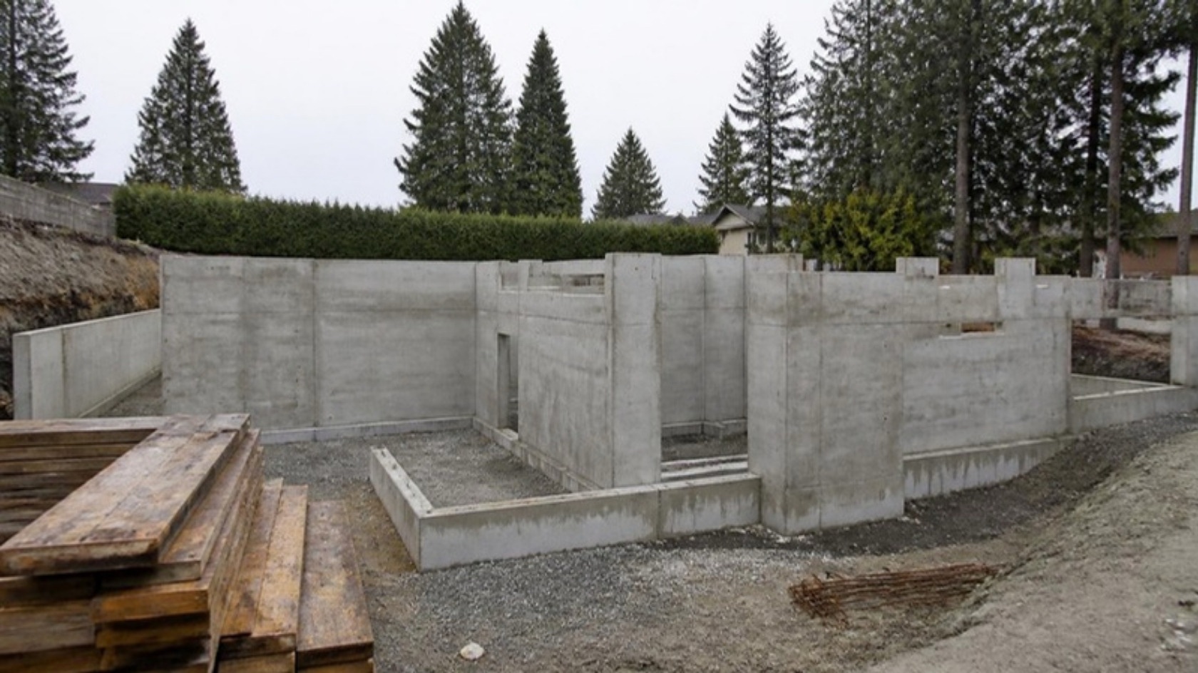 Freshly stripped concrete foundation walls for a new home